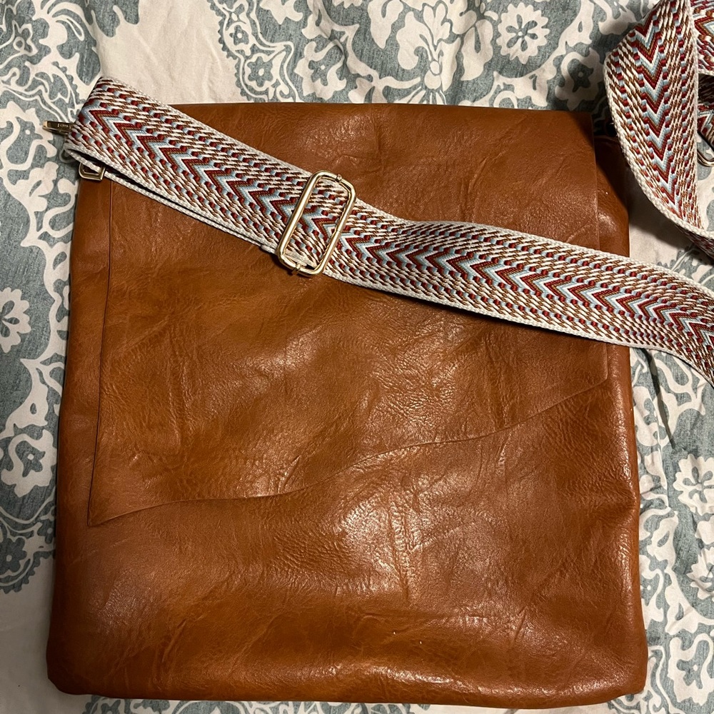 Vegan leather messenger bag with embroidered strap